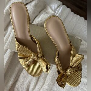 Never worn Amazon Gold Bow Heels